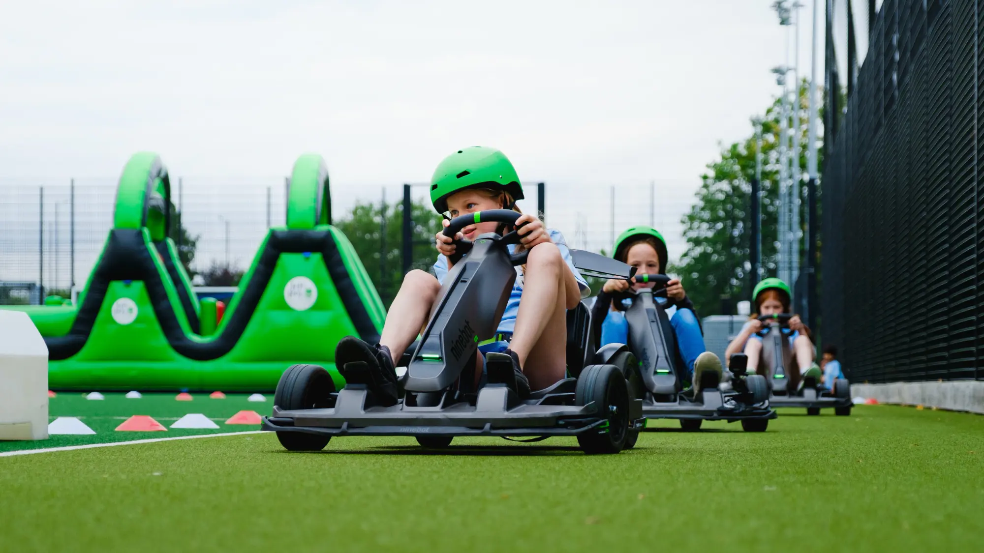 Boys driving karts during holiday club at Homefield Prep