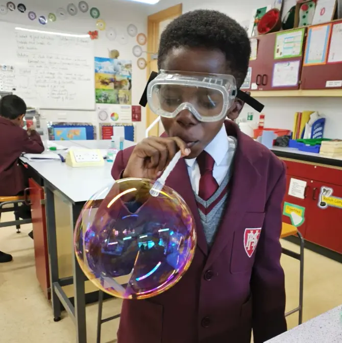 Student in the lab testing bubble solution at Homefield Prep
