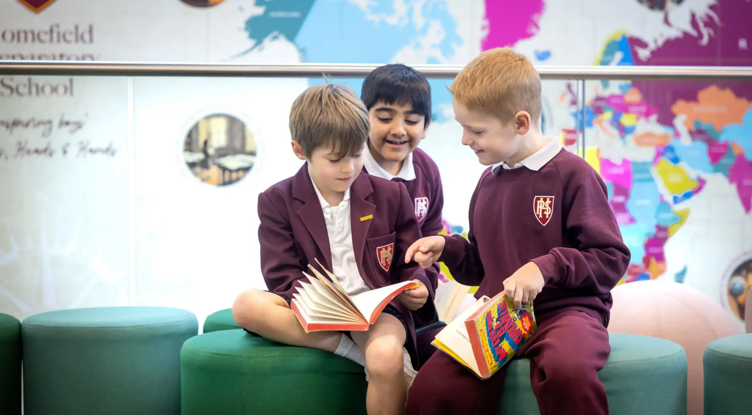 Boys in the library reading to each other at Homefield Prep 