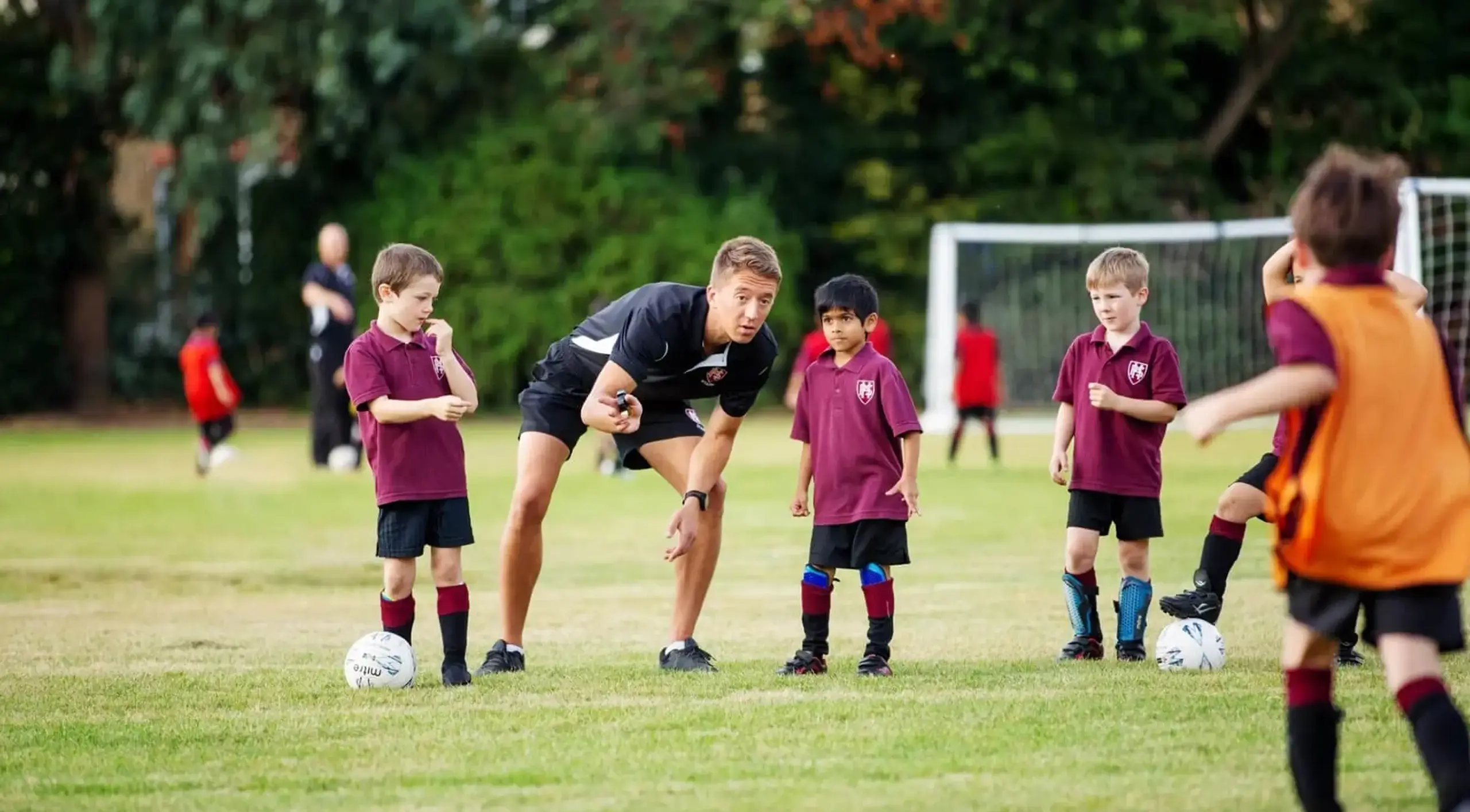 Sports teacher with pupils at Homefield Prep, a private school in Sutton