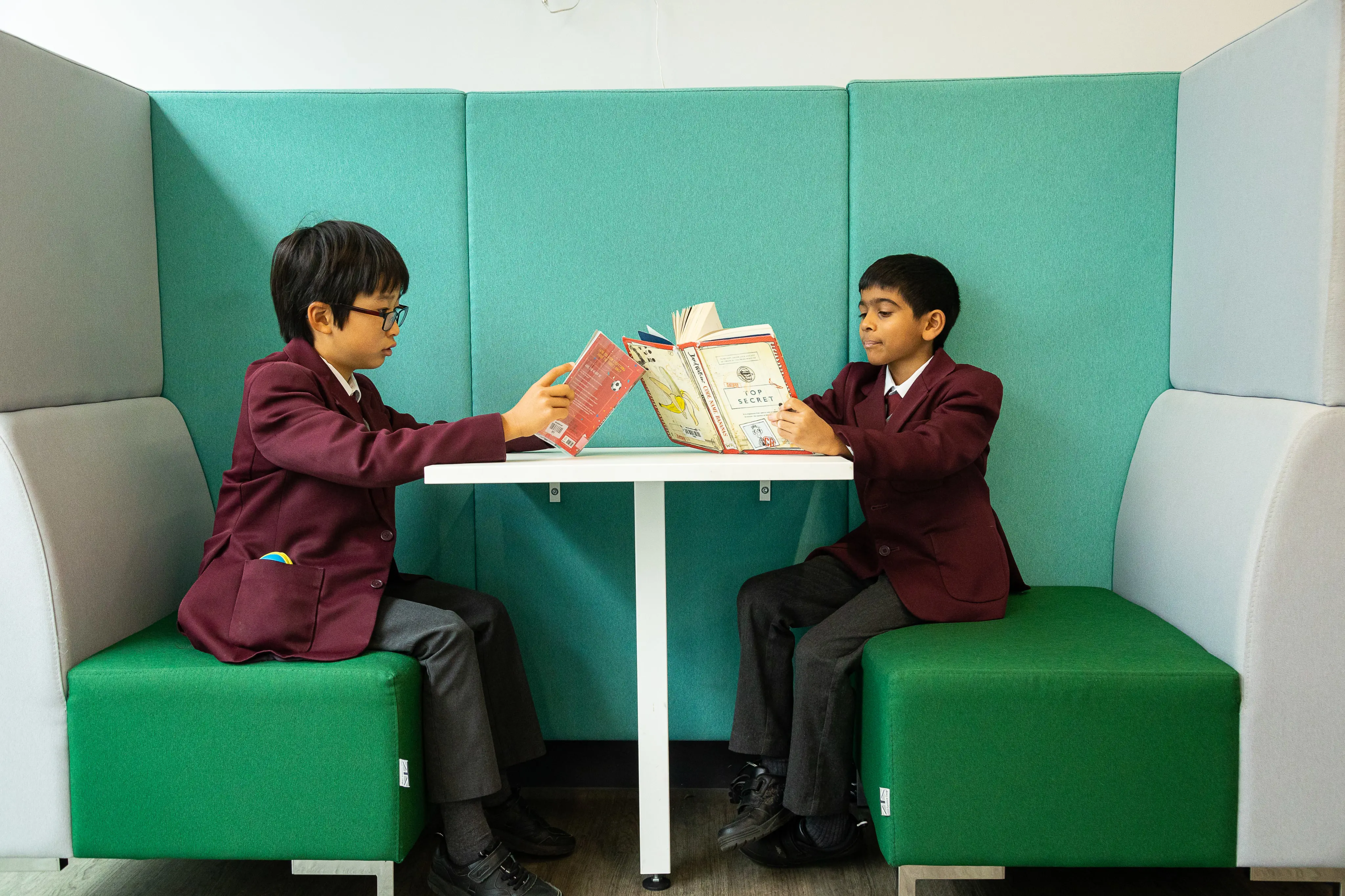 Boys reading together in the Library at Homefield Prep 