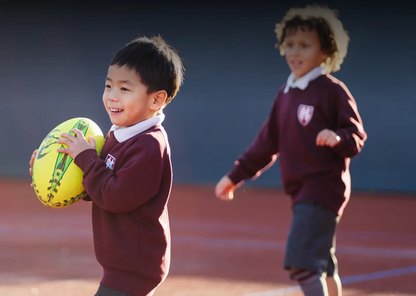 Pupils playing rugby in Breakfast Club at Homefield Prep, a private school in Sutton
