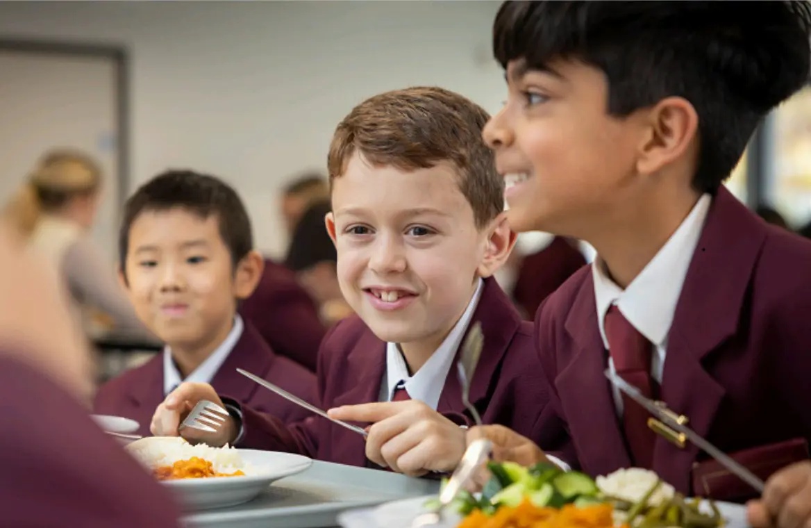 Boys eating in he cafeteria in at Homefield Prep 