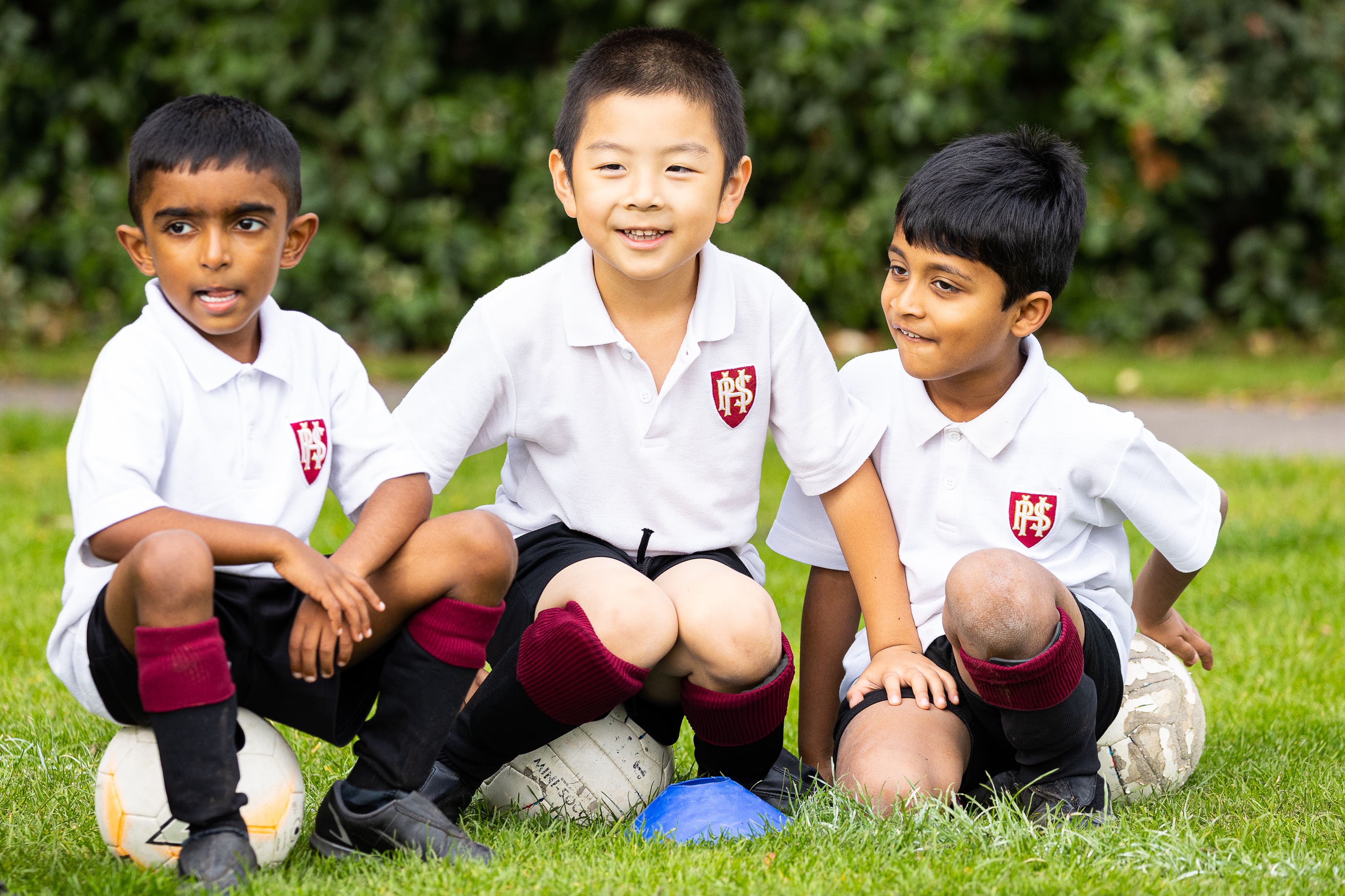 Students playing football in PE lesson at Homefield Prep